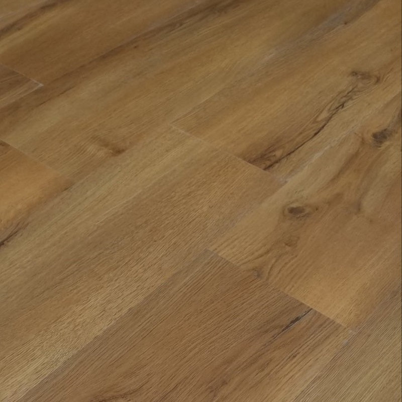 Light brown wood flooring planks with a natural oak grain pattern close up cameo. 