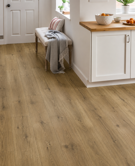 Fellside Oak XL Luxury Click Vinyl Flooring 7mm in a bright modern kitchen, showcasing extra-large natural oak-effect planks with realistic wood grain, authentic knots, textured matt finish and waterproof SPC click flooring.