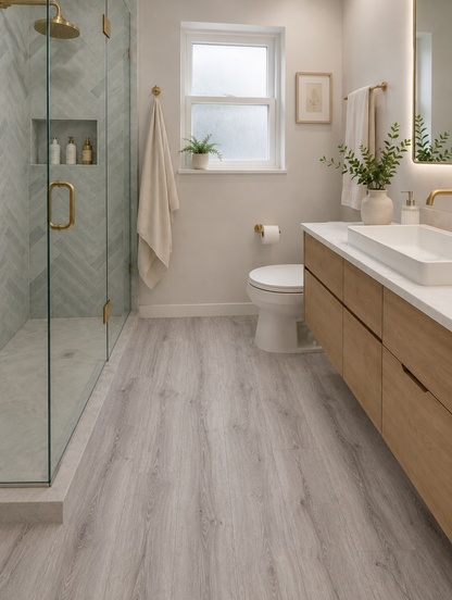 Modern bathroom featuring Gran Canaria Luxury Click Vinyl Flooring 5mm with mid-grey oak-effect SPC rigid core flooring, authentic wood grain texture, natural knot detailing, embossed matt finish and 100% waterproof click vinyl flooring.