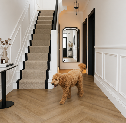 Lesedi Oak Herringbone SPC flooring installed in a contemporary hallway with a dog, featuring realistic oak-effect flooring, waterproof durability and scratch-resistant performance for busy homes with pets.