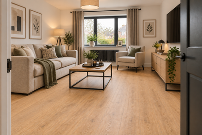 A bright, modern living room featuring light oak wood laminate flooring, styled with a beige sofa, a wooden coffee table, and neutral-toned furniture.